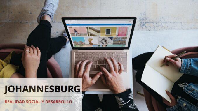 Photo by Windows person using microsoft surface laptop on lap with two other people