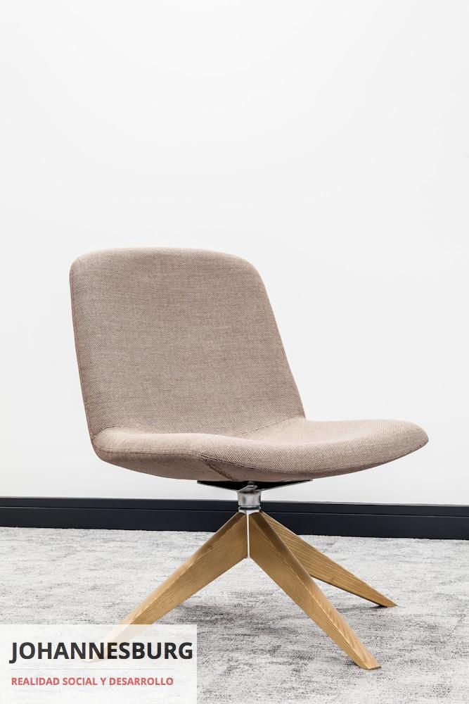 brown wooden framed gray padded chair