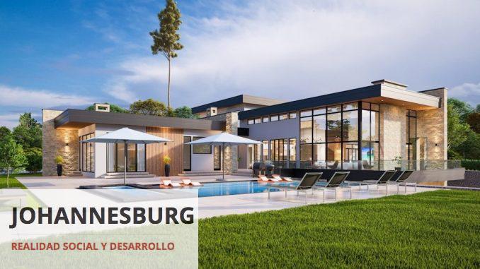 a modern house with a pool and lounge chairs